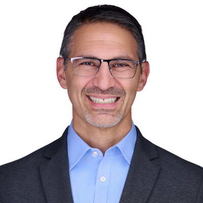 Headshot of Dr. Charlie Apigian, Chief Data Strategist and leader in AI strategy and agentic workflows.